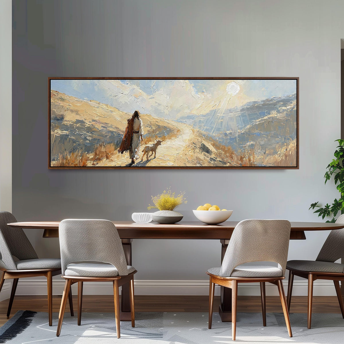 Jesus walking a sunlit hillside path with a sheep long horizontal canvas print above a dining table