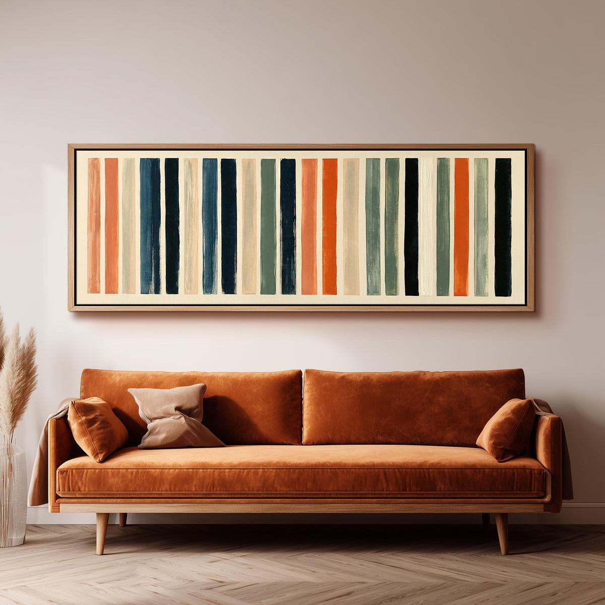 Bold peach, sage and navy stripes panoramic canvas print above a sofa in a living room