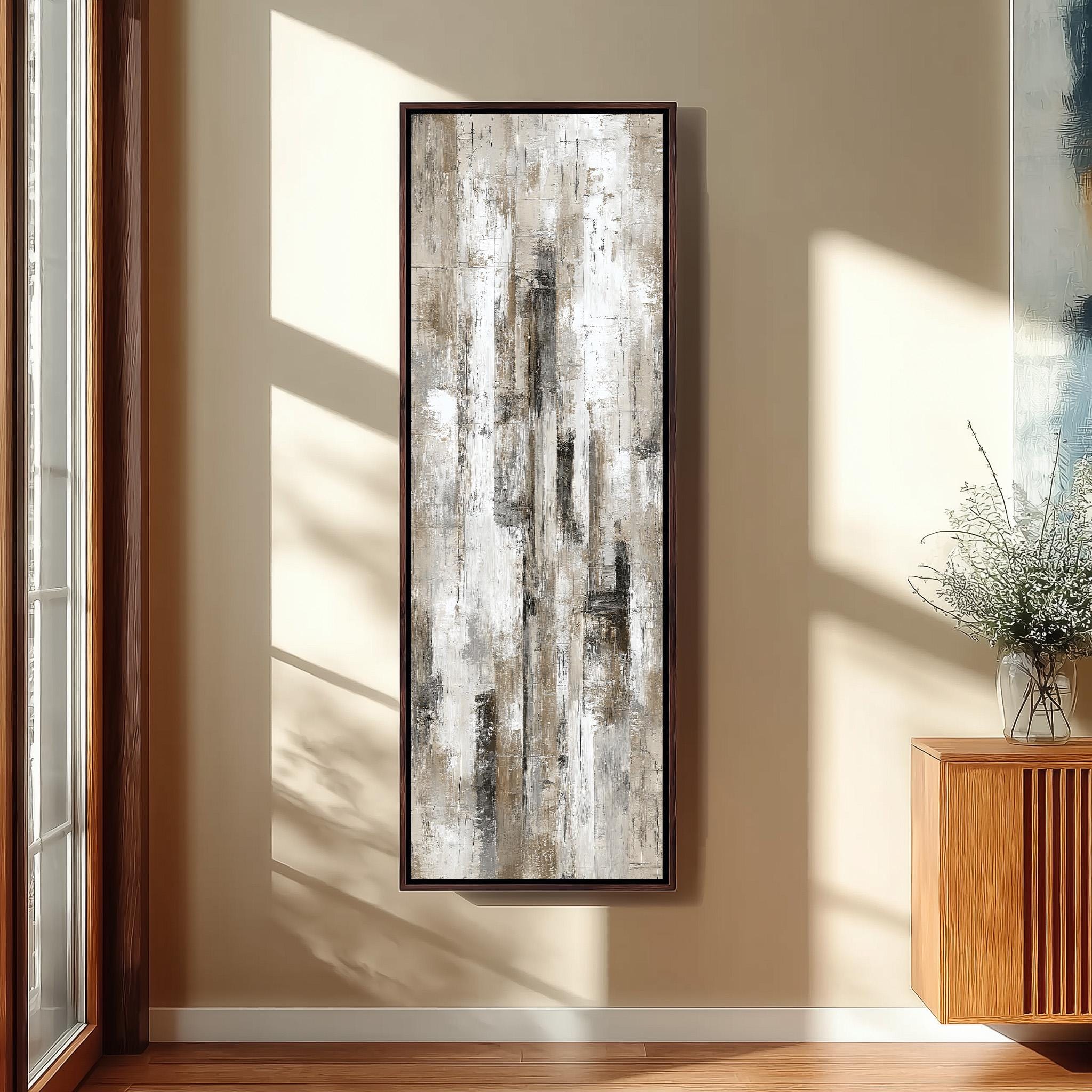 a large abstract painting hanging on a wall in a room with wooden furniture and a window.