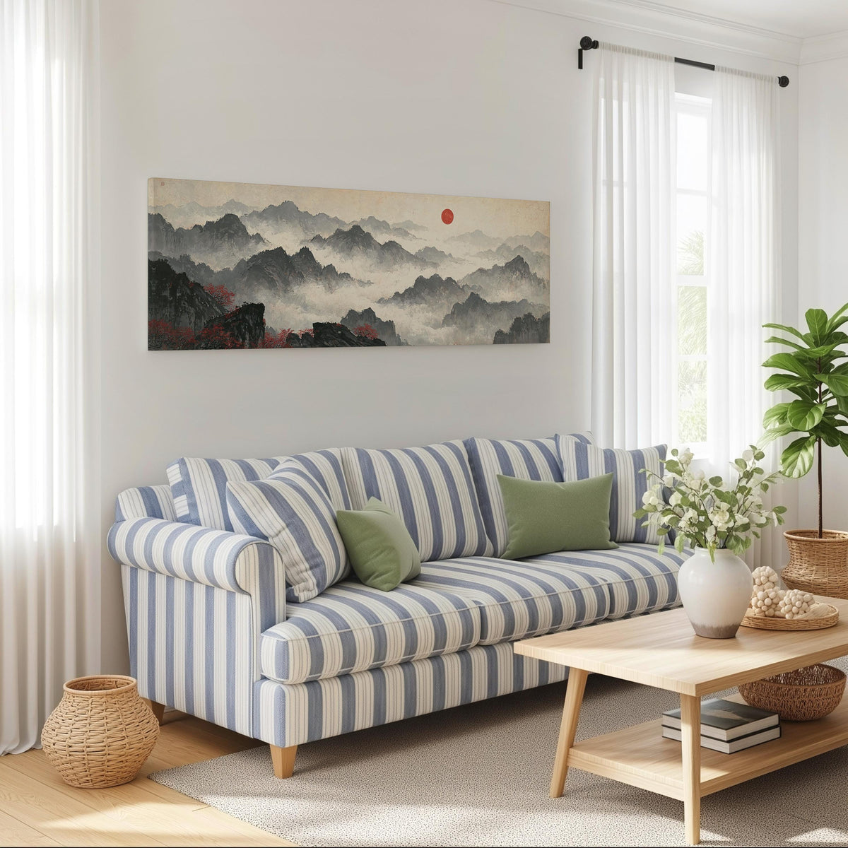 Misty ink mountains under a red sun long horizontal canvas print above a striped sofa in a coastal living room