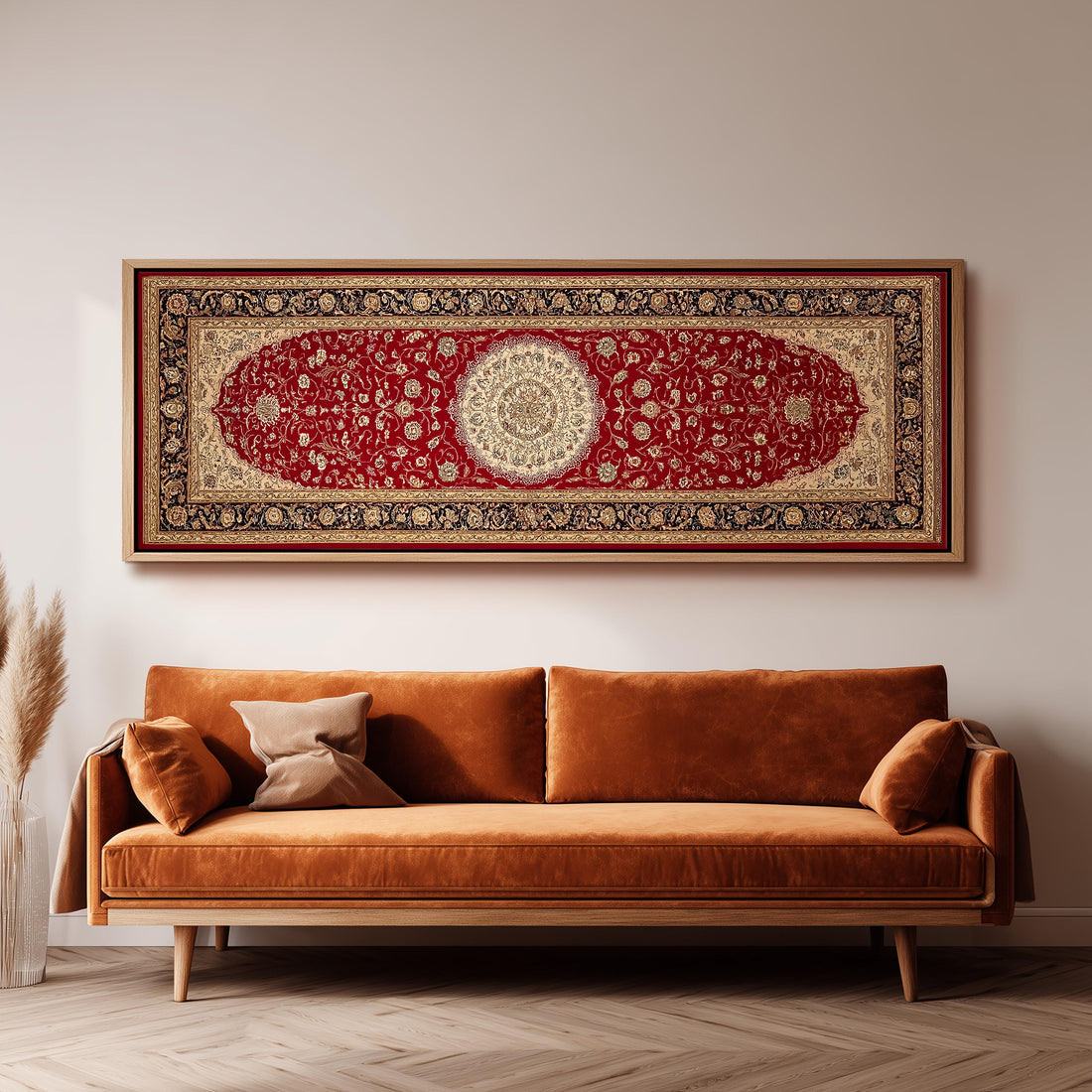 a large, ornate red and gold rug hanging on a white wall above a brown sofa with two pillows.