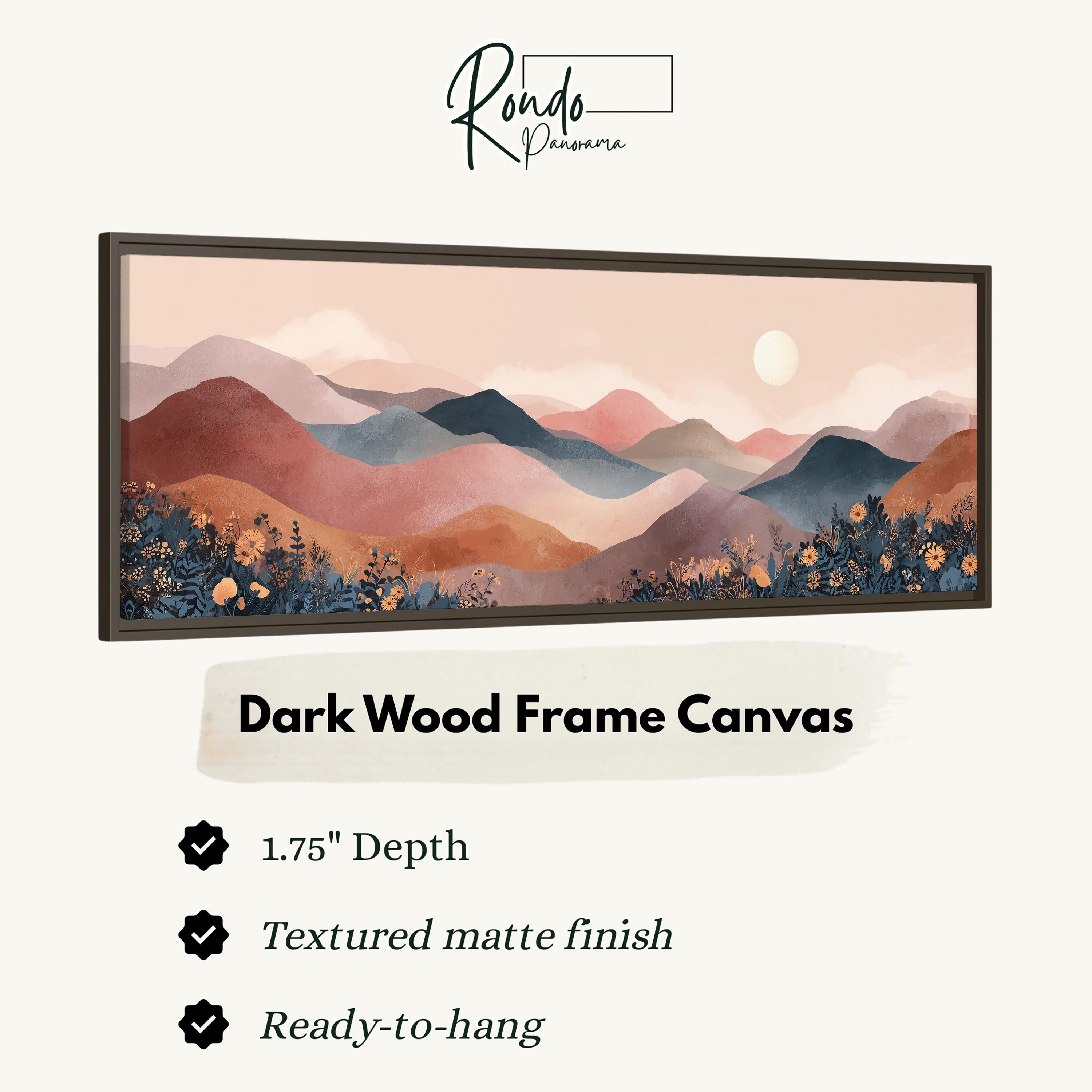 The image is a framed artwork depicting a scenic landscape with mountains and a sunset.