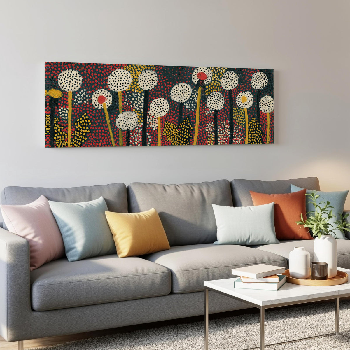Dotted dandelion meadow panoramic canvas print above a grey sofa in a living room