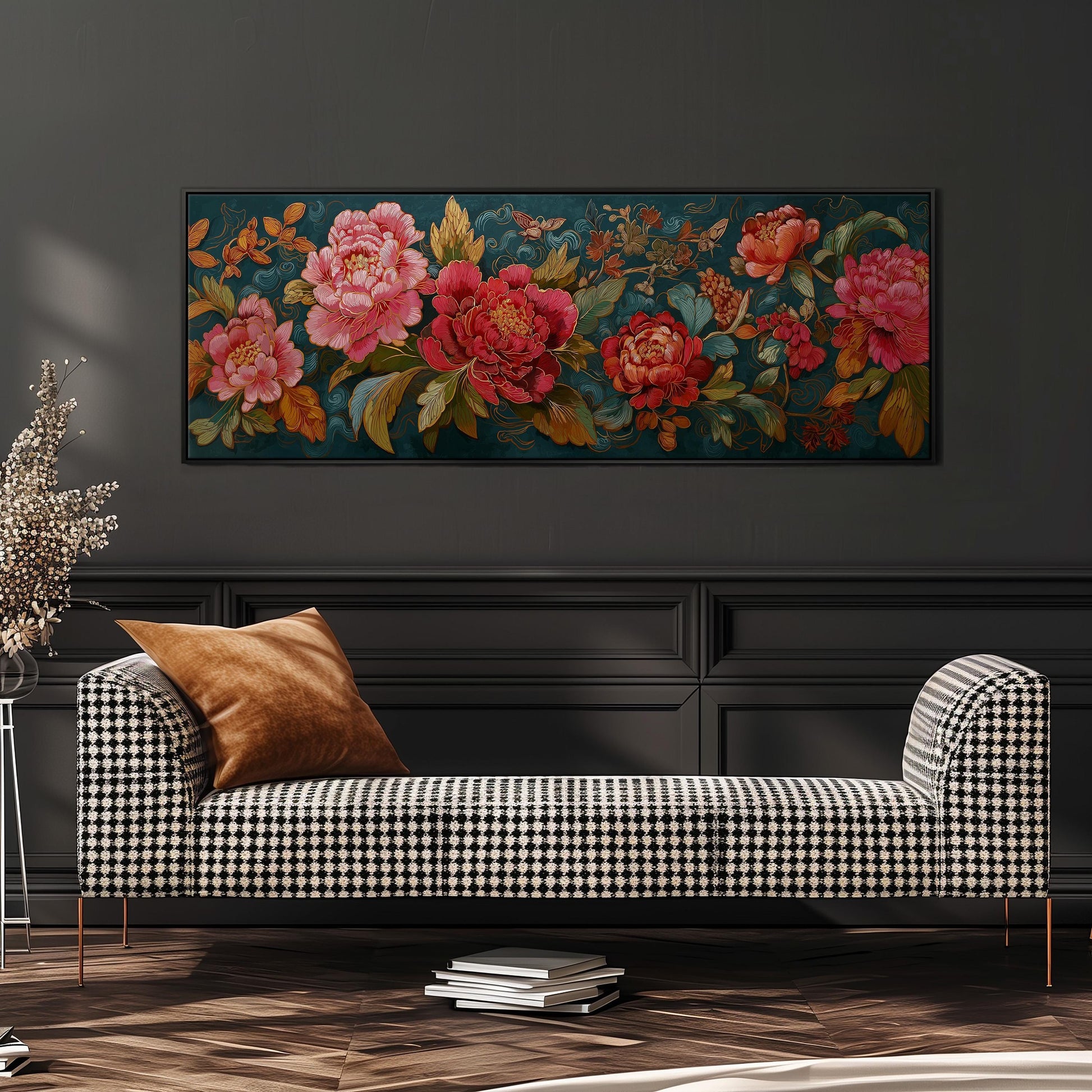 a large floral painting hanging on a wall above a black and white checkered sofa with a brown throw pillow.
