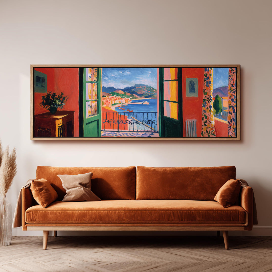 a large, colorful painting of a balcony overlooking a scenic landscape, hanging on a wall above a brown sofa.