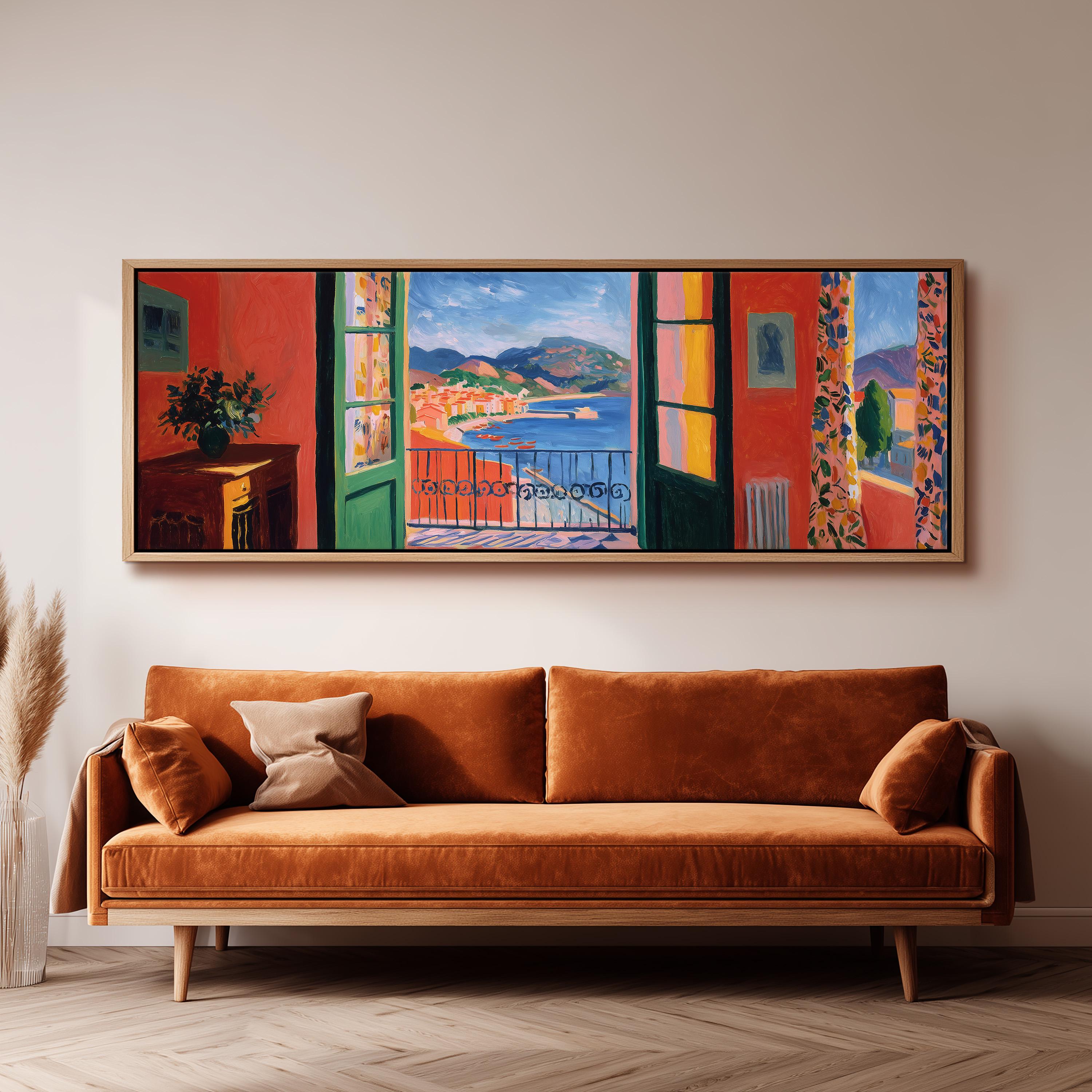 a large, colorful painting of a balcony overlooking a scenic landscape, hanging on a wall above a brown sofa.