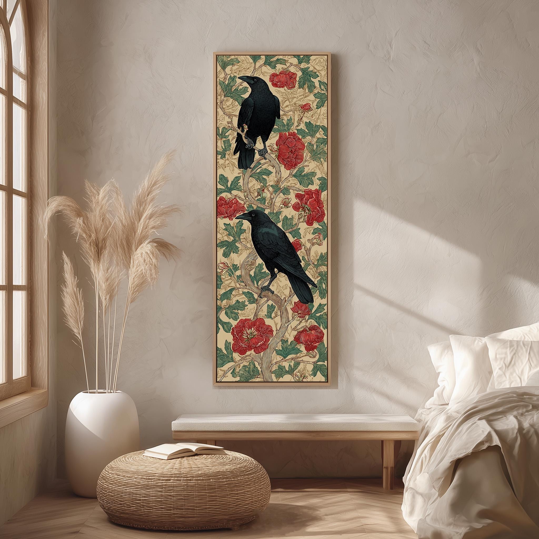 a large, ornate painting of two black birds perched on a branch with red flowers, hanging on a wall in a room with a white bed, a wicker ottoman, and a potted plant.