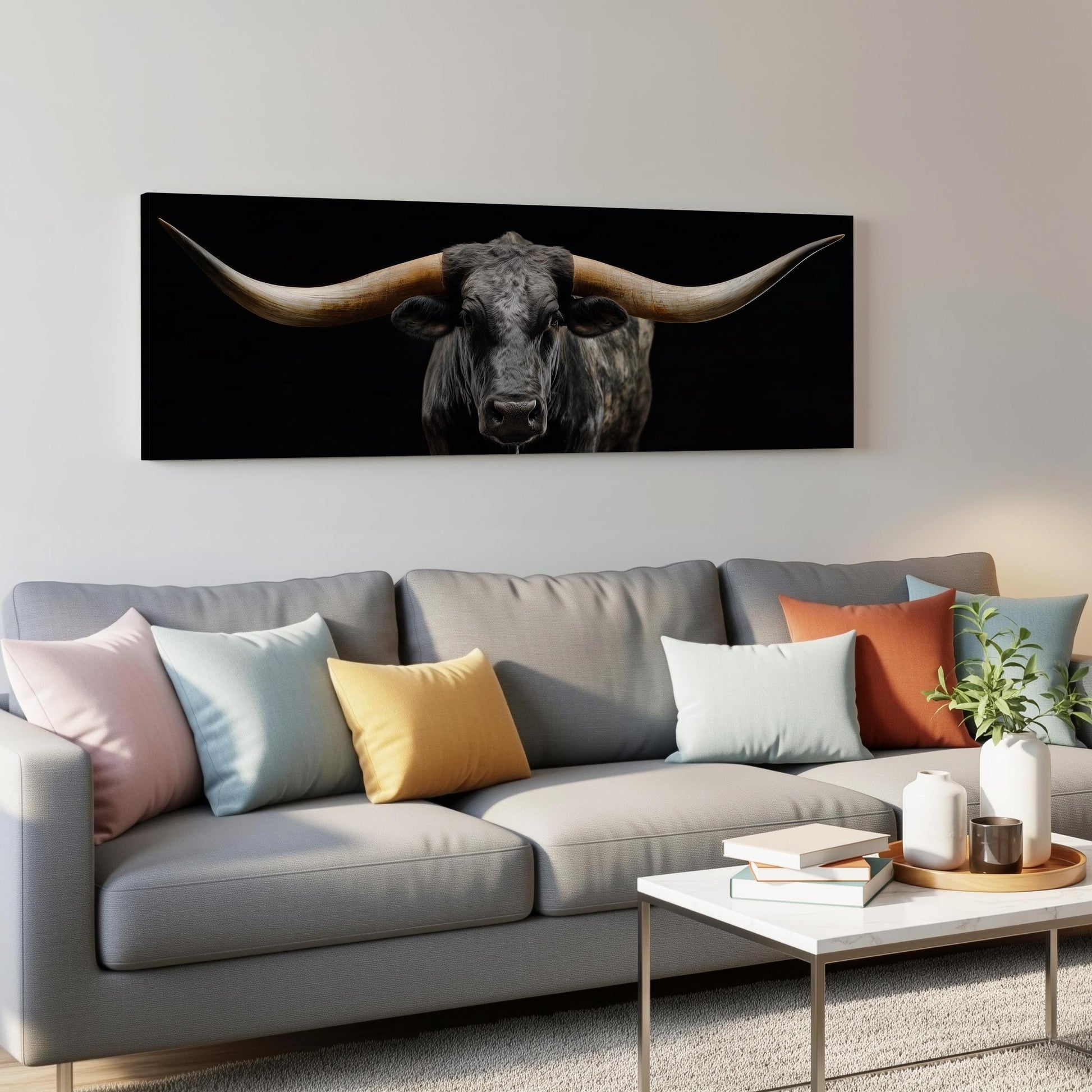 a living room with a couch and a painting on the wall