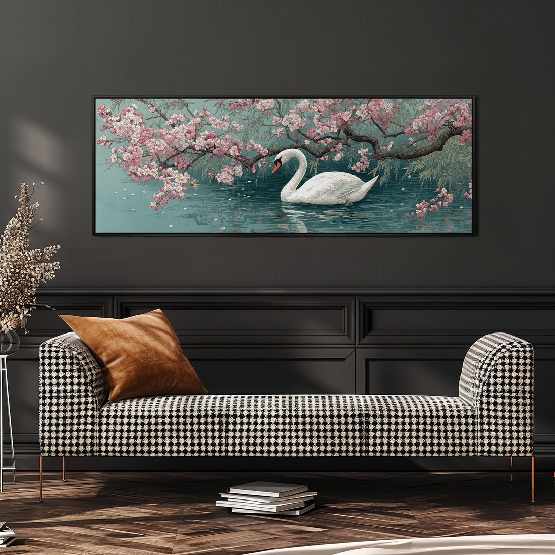 A large painting of a swan floating on a pond, surrounded by blooming pink flowers, hangs on a wall above a brown sofa.