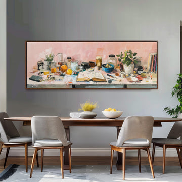 a large painting of a table with various objects, including a bowl, a vase, a plant, and a book, displayed on the wall above a wooden dining table with four chairs.