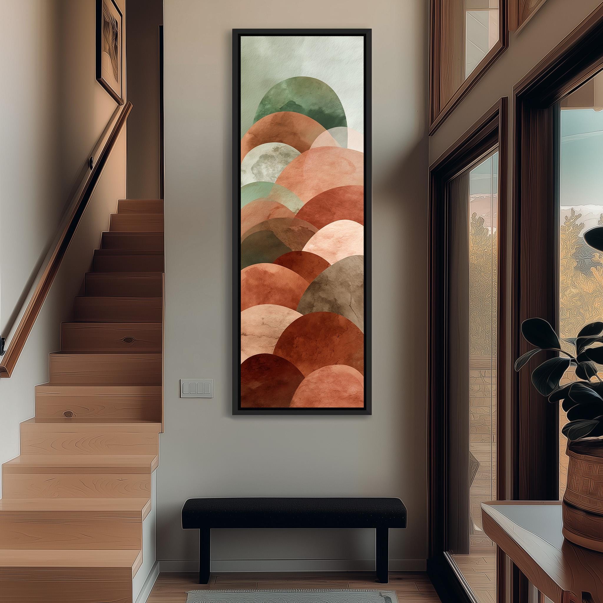 a modern and minimalist interior design with a large abstract painting hanging on the wall above a black bench. The painting consists of various shades of orange and brown circles, creating a visually striking and contemporary aesthetic.