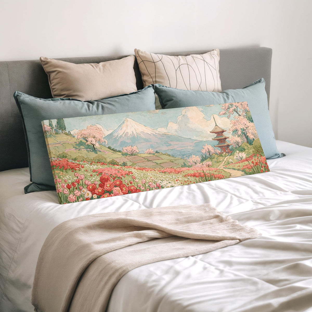 Mount Fuji with sakura and a pagoda wide panoramic canvas print laid on a bed to show its size