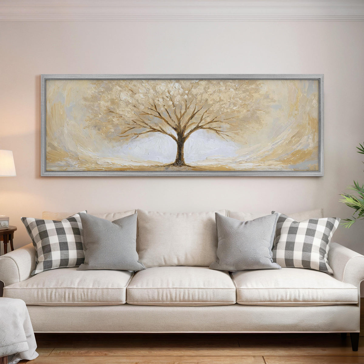Golden winter tree panoramic canvas print above a white sofa in a bright living room