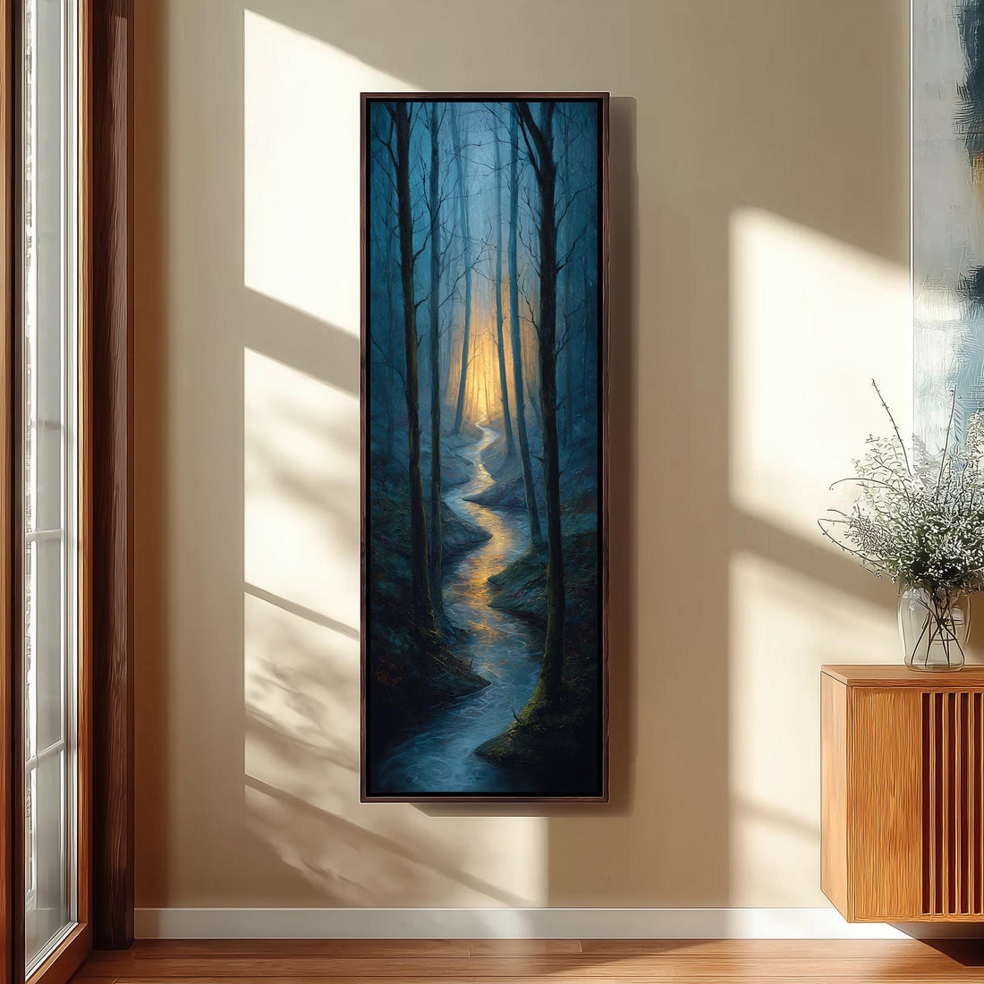 a serene indoor setting with a wooden staircase leading up to a large window, which offers a view of a forest. A large painting of a winding path through the trees is hanging on the wall, adding a touch of nature to the space. A black bench is positioned in front of the painting, inviting visitors to sit and enjoy the view.