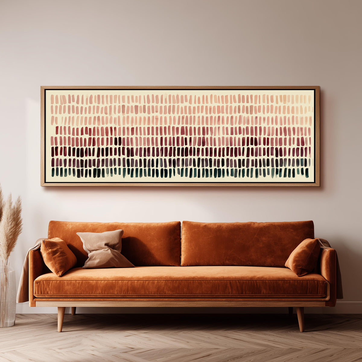 Brushmarks fading from blush to deep maroon long horizontal canvas print above a sofa in a living room