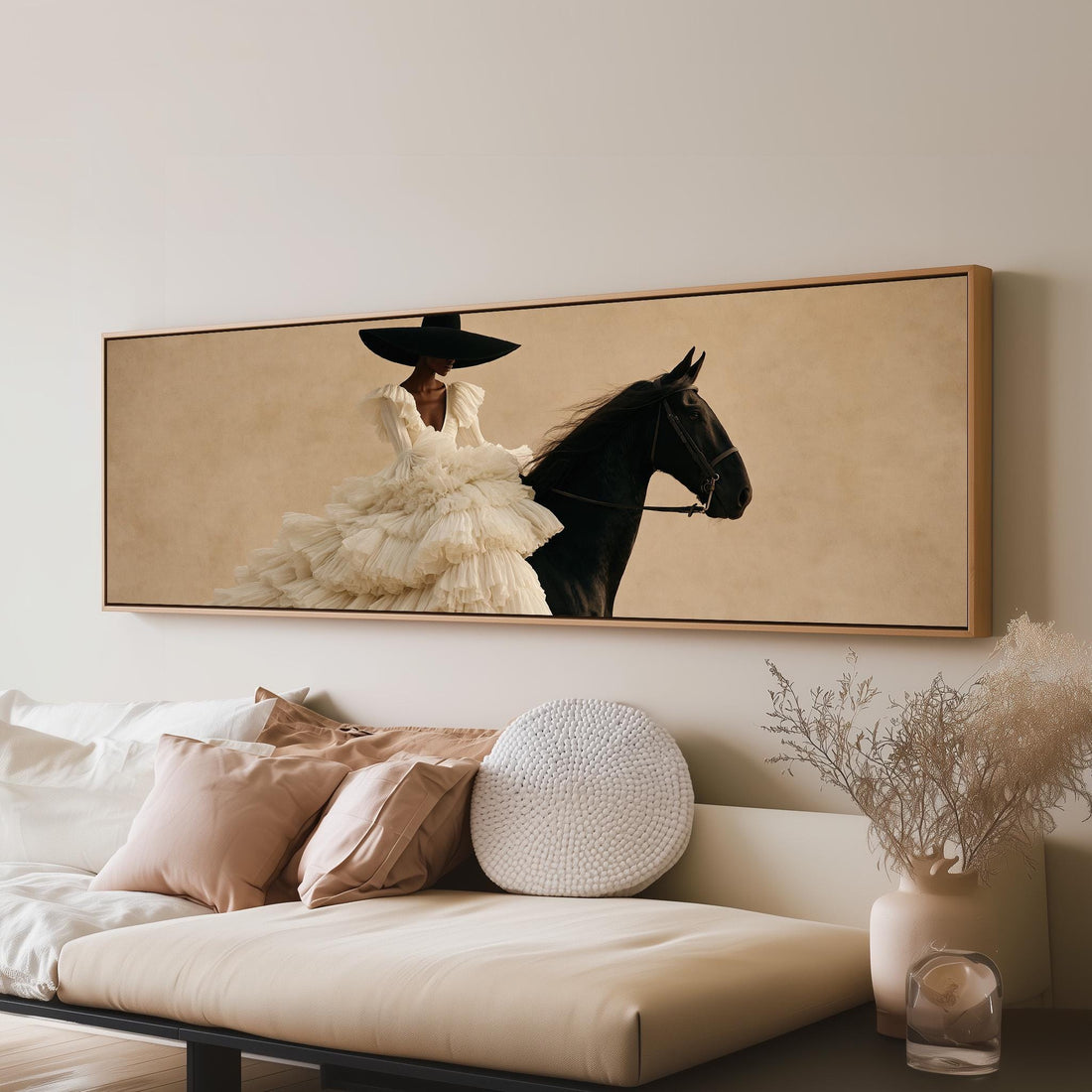Woman in a ruffled gown on a black horse long horizontal canvas print above a sofa in a living room