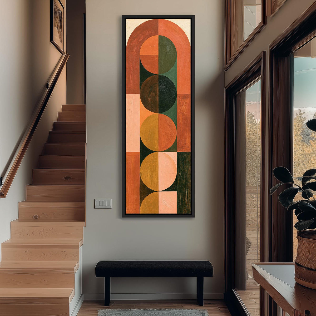 Arch and circle totem in terracotta and mustard tall narrow canvas print beside a staircase in an entryway