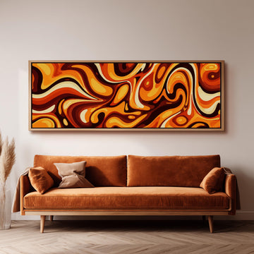 a large abstract painting hanging on a wall above a brown sofa with two pillows.