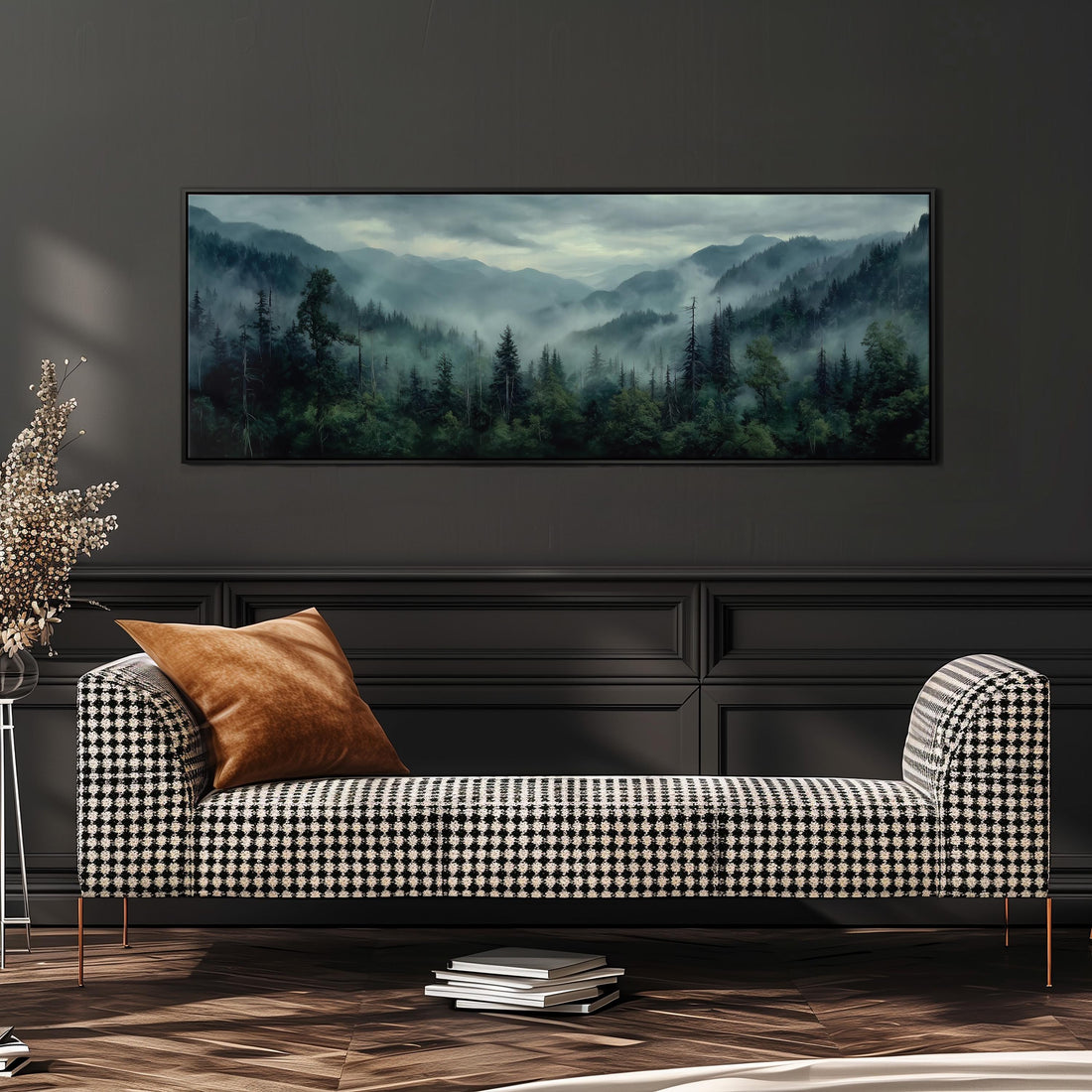 a large framed landscape painting hanging on a wall above a black and white checkered sofa with a brown throw pillow.