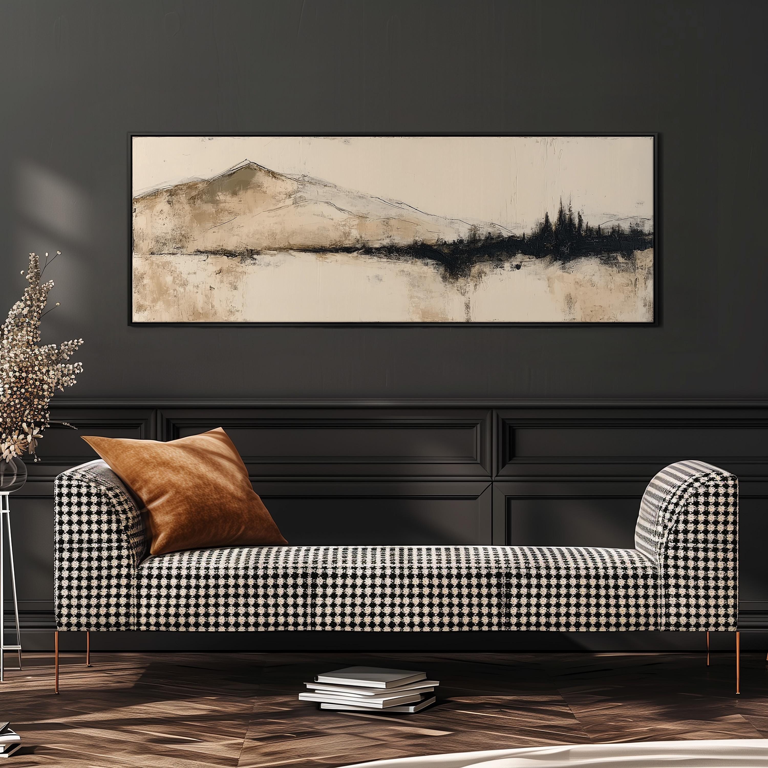 a black and white checkered sofa with a brown throw pillow, set against a dark wall with a framed landscape painting hanging above it.