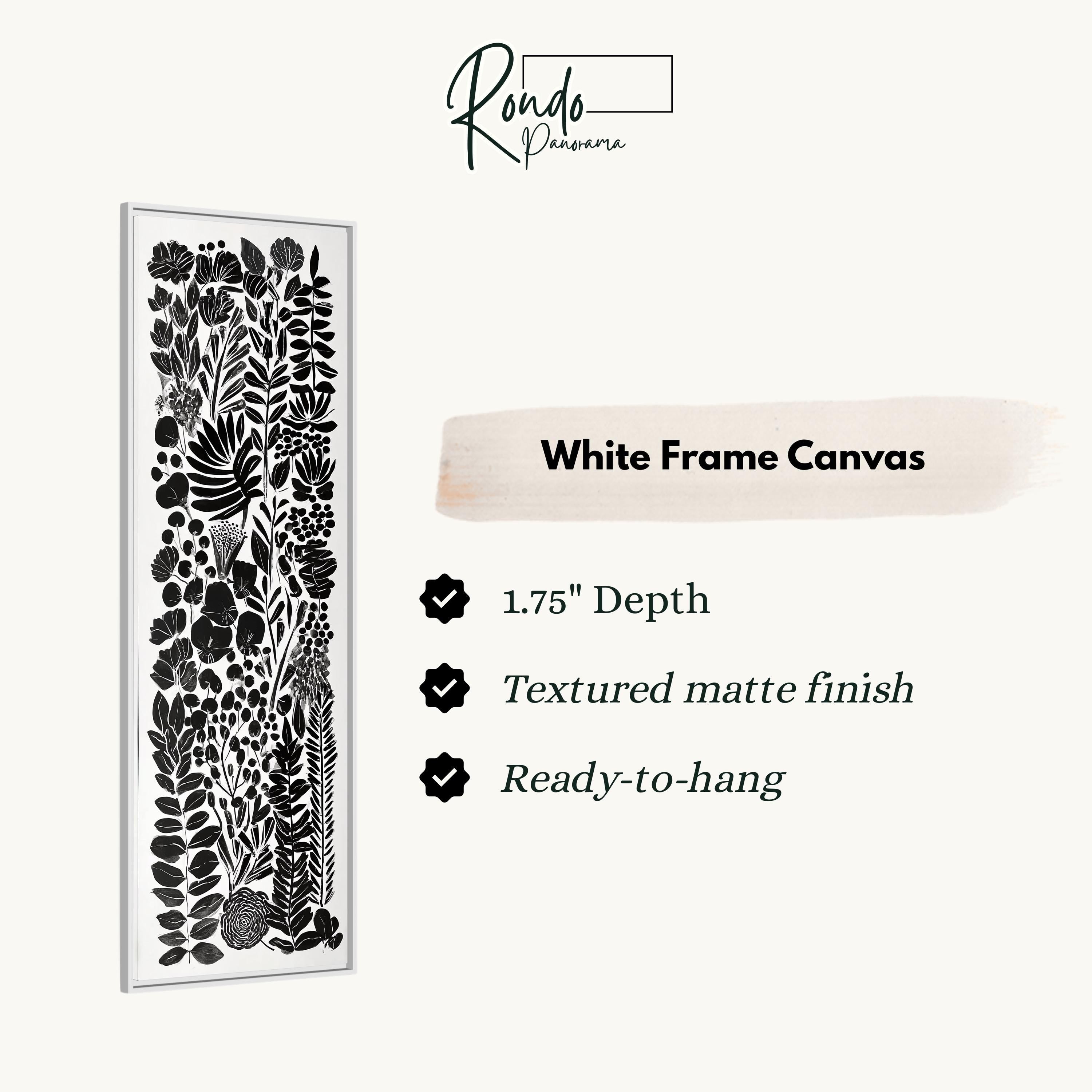 The image is a product description for a white frame canvas. It features a black and white floral pattern on the canvas, with a 1.75" depth, a textured matte finish, and a ready-to-hang feature.