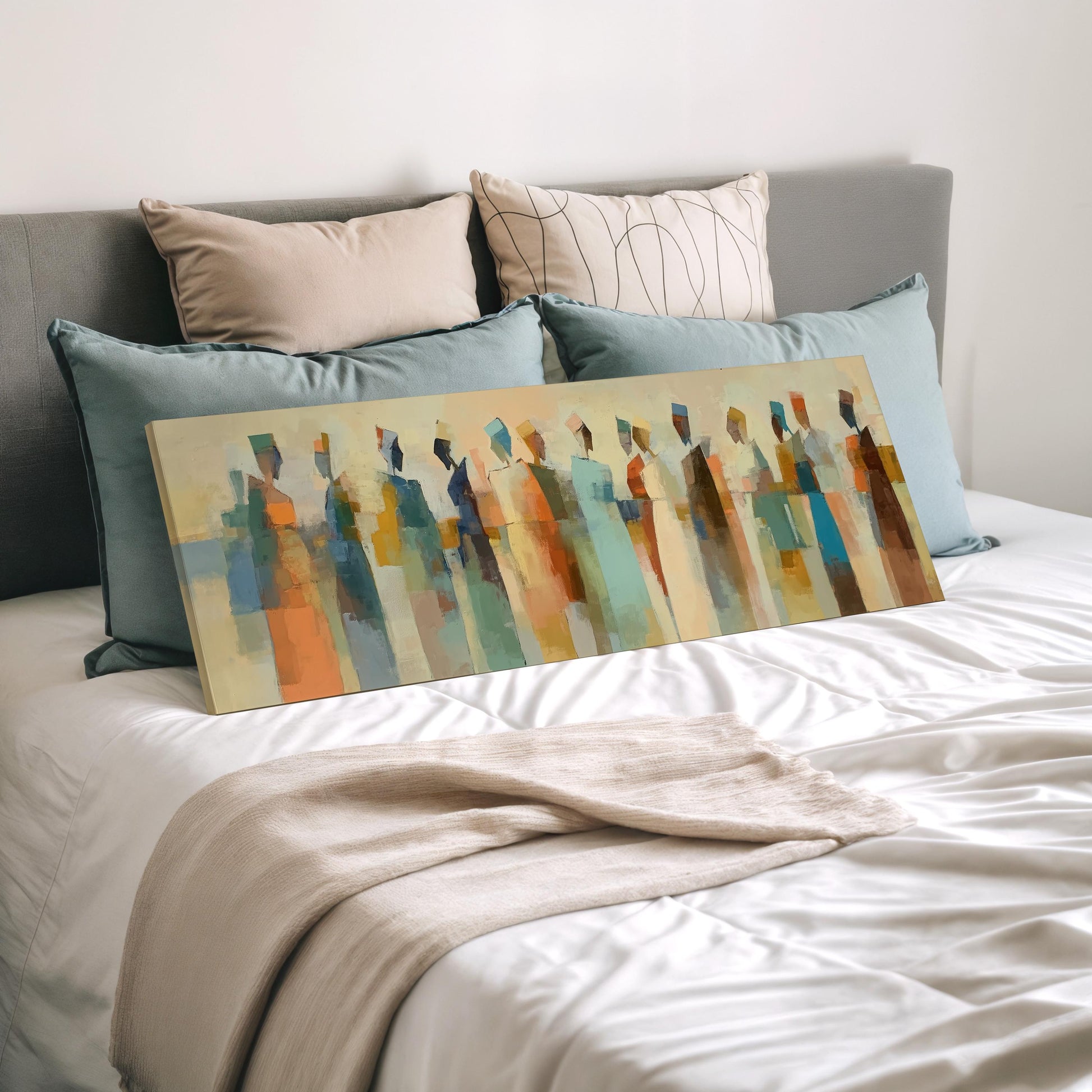 a large abstract painting displayed on a bed, with a gray headboard and white bedding.
