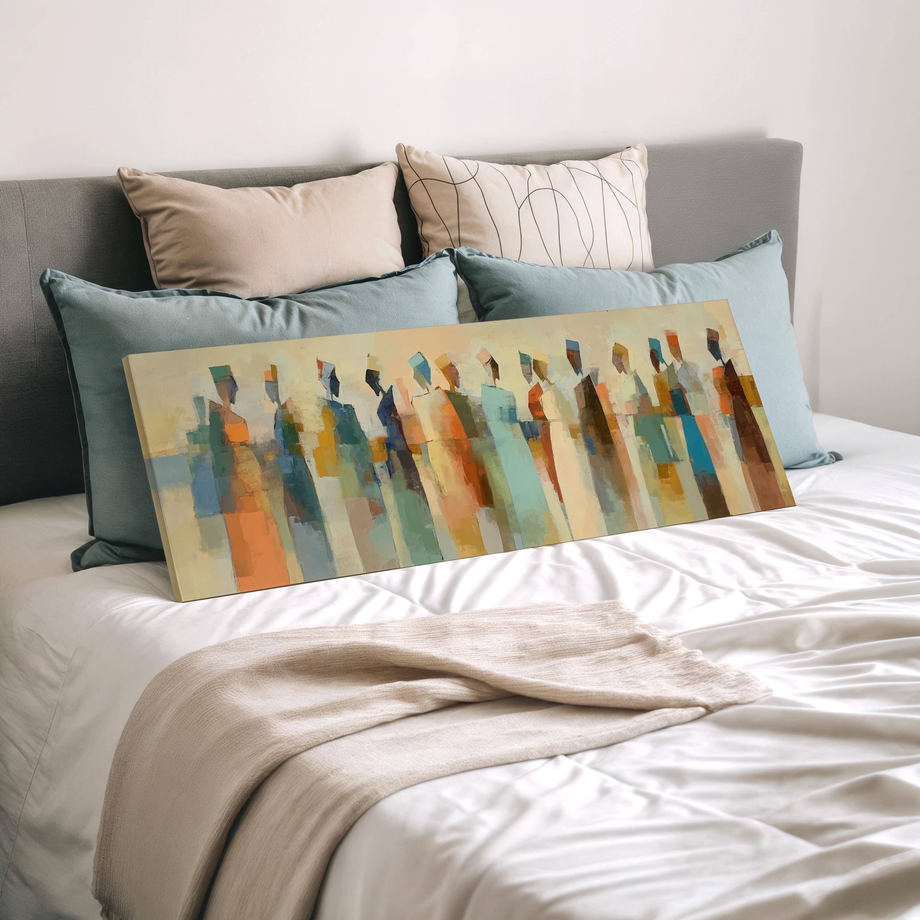 a large abstract painting displayed on a bed, with a gray headboard and white bedding.