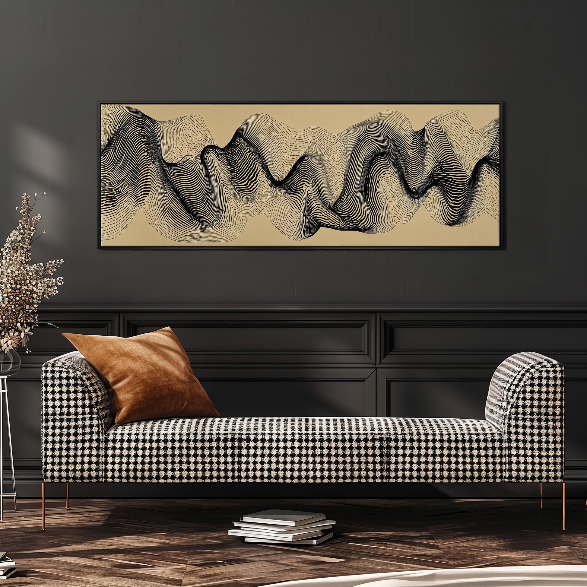 a modern living room with a black and white checkered sofa, a stack of books, and a large abstract painting hanging on the wall above the sofa.