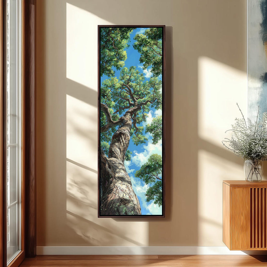 a large, framed painting of a tree with a twisted trunk and lush green leaves, hanging on a wall in a room with a wooden floor and a window.