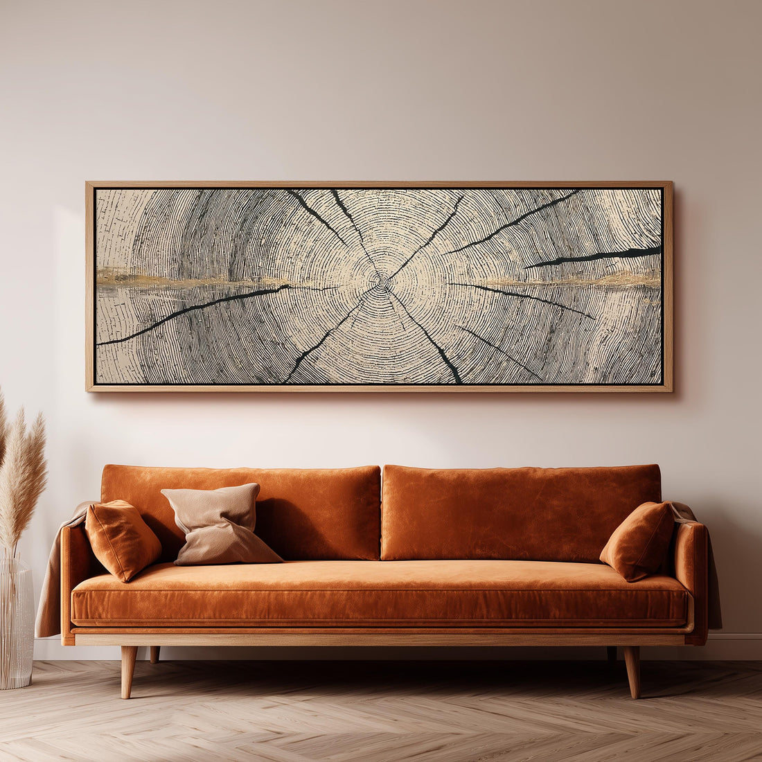 Pale gold wood ring long horizontal canvas print above a sofa in a living room