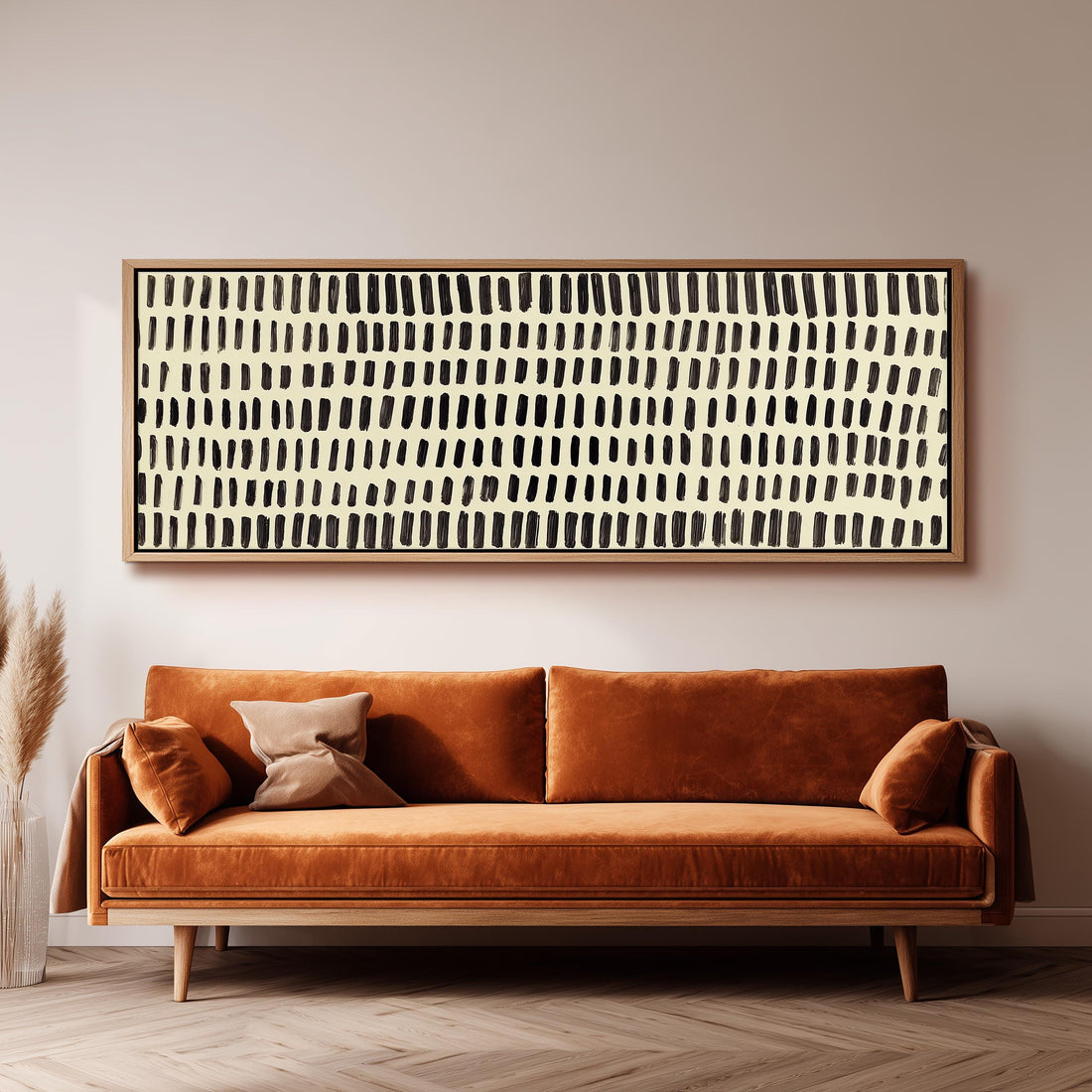 a modern living room with a black and white checkered sofa, a stack of books, and a large abstract painting on the wall.