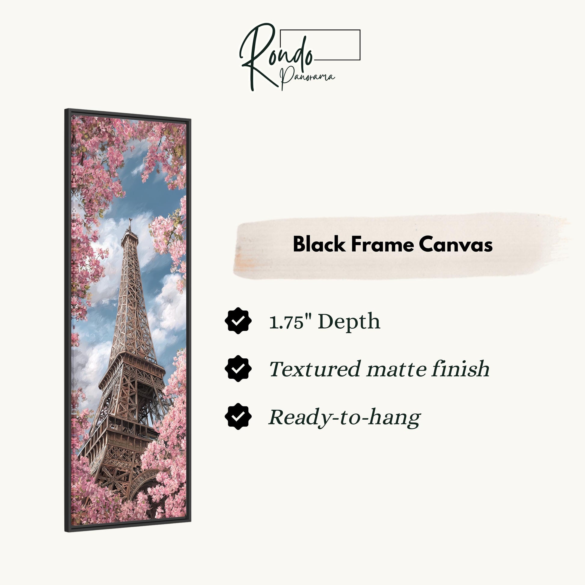 a black frame canvas with a photograph of the Eiffel Tower surrounded by pink flowers.