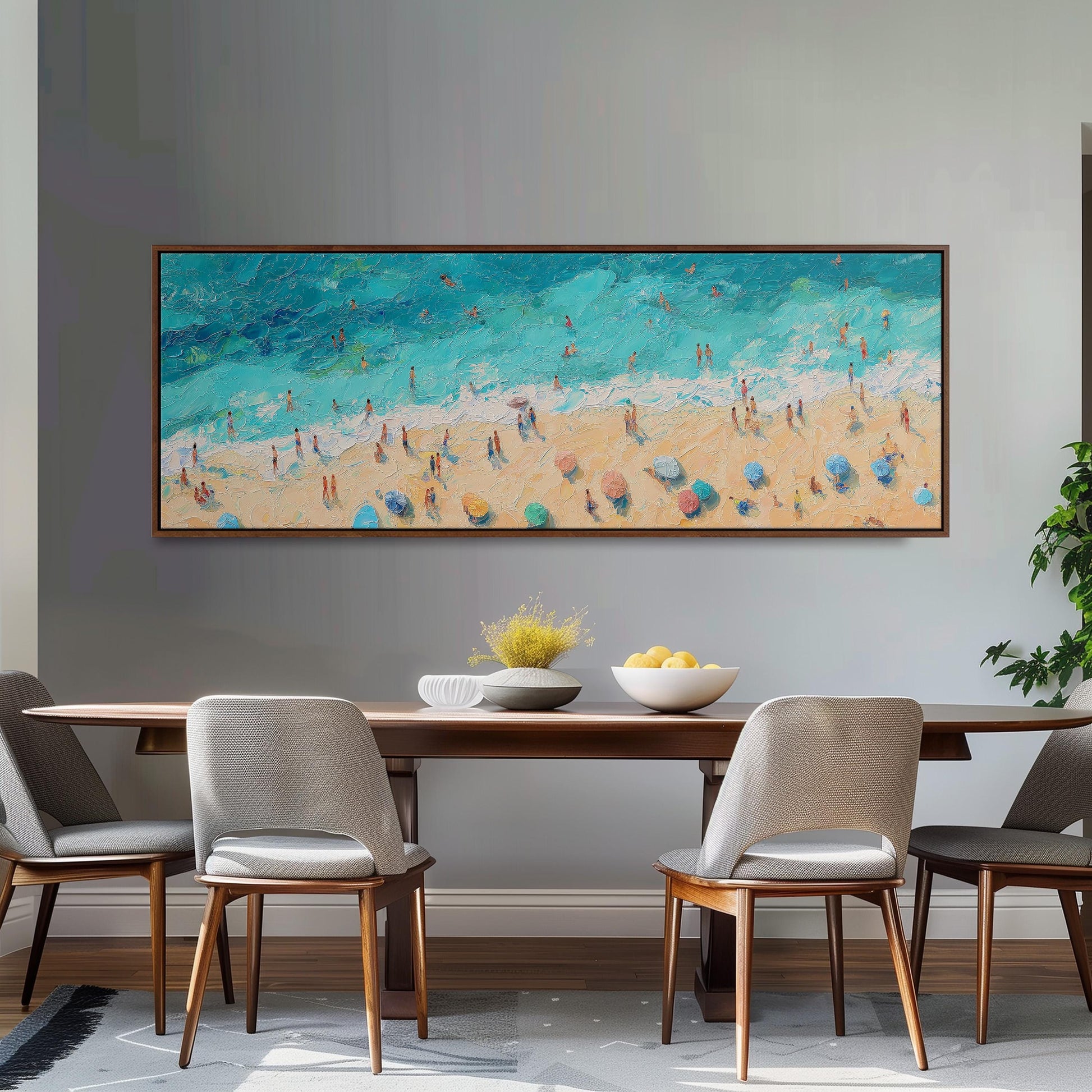 a large painting of a beach scene hanging on a wall above a wooden dining table with four chairs.