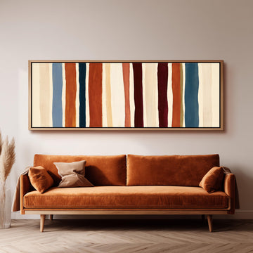 Rust, navy and maroon stripes long horizontal canvas print above a sofa in a living room