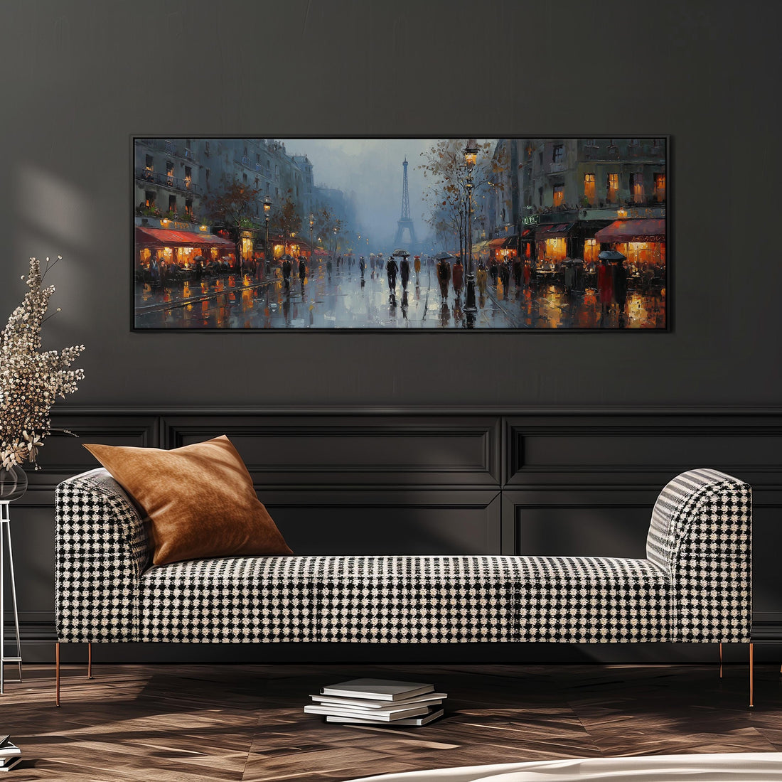 a large painting of a rainy Paris street scene, with the Eiffel Tower visible in the background. The painting is hung on a wall above a black and white checkered sofa, which is positioned in front of a stack of books.