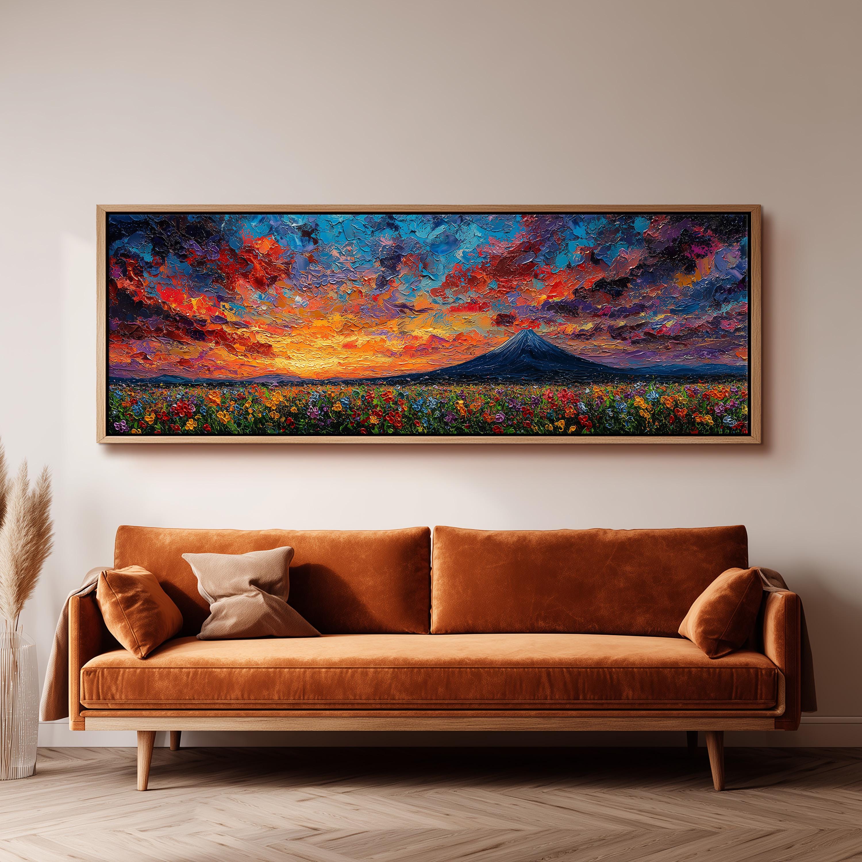 a large, vibrant painting of a sunset over a field of flowers hanging on a wall above a brown sofa.