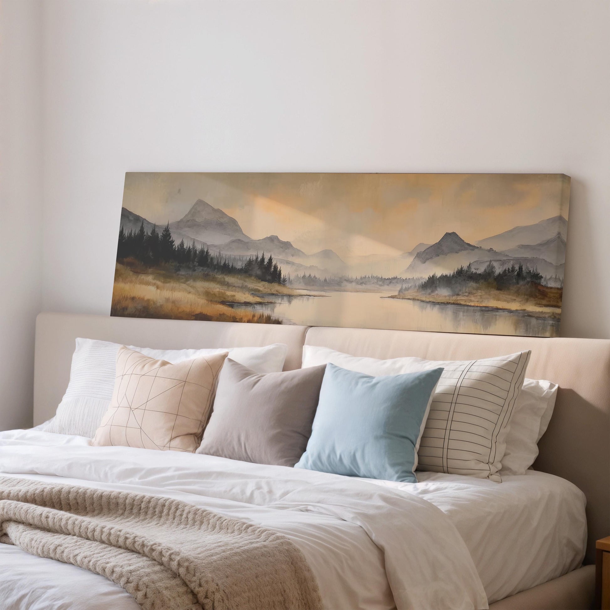 a large landscape painting hanging on a wall above a bed with white bedding and pillows.