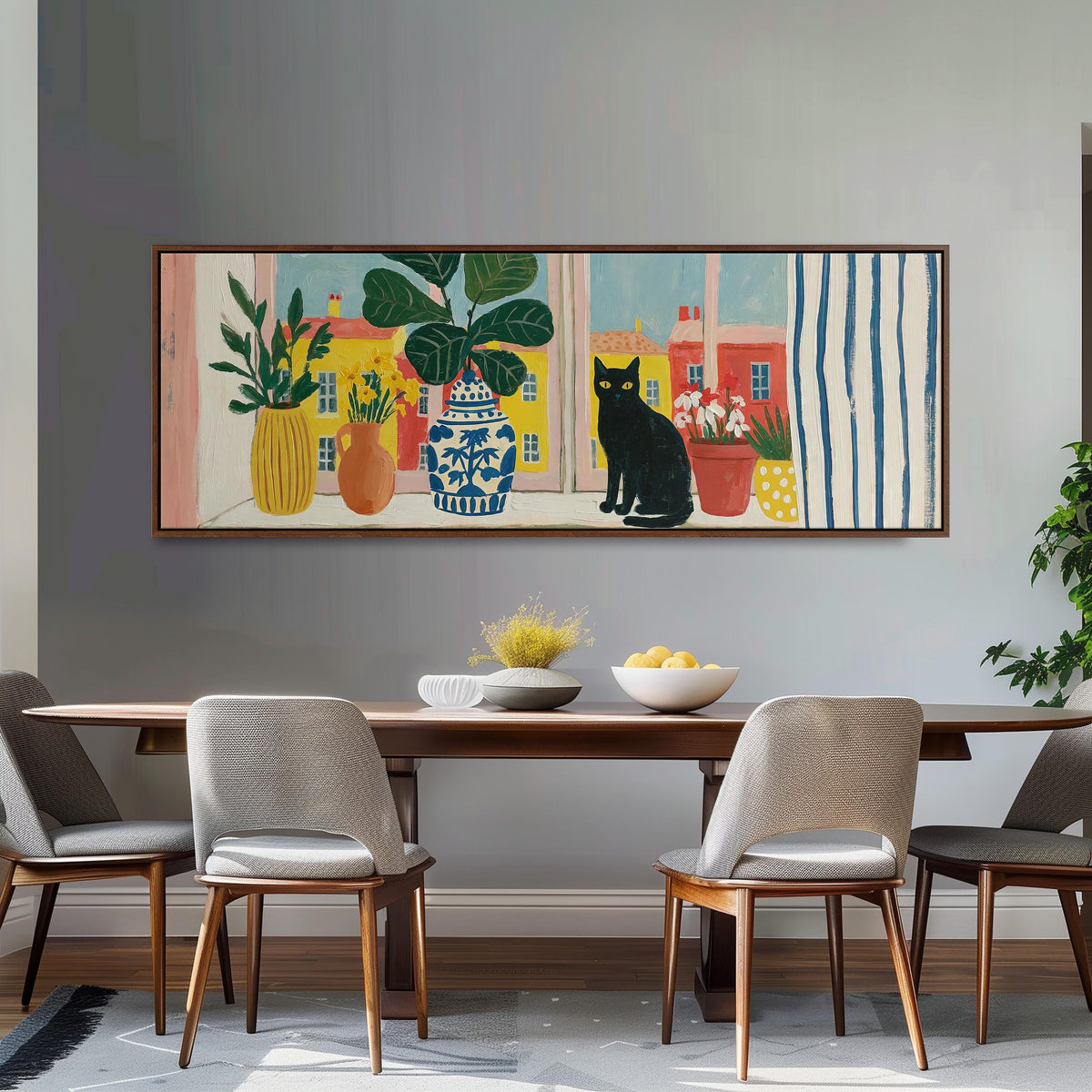 Black cat on a windowsill overlooking a colorful village long horizontal canvas print above a dining table