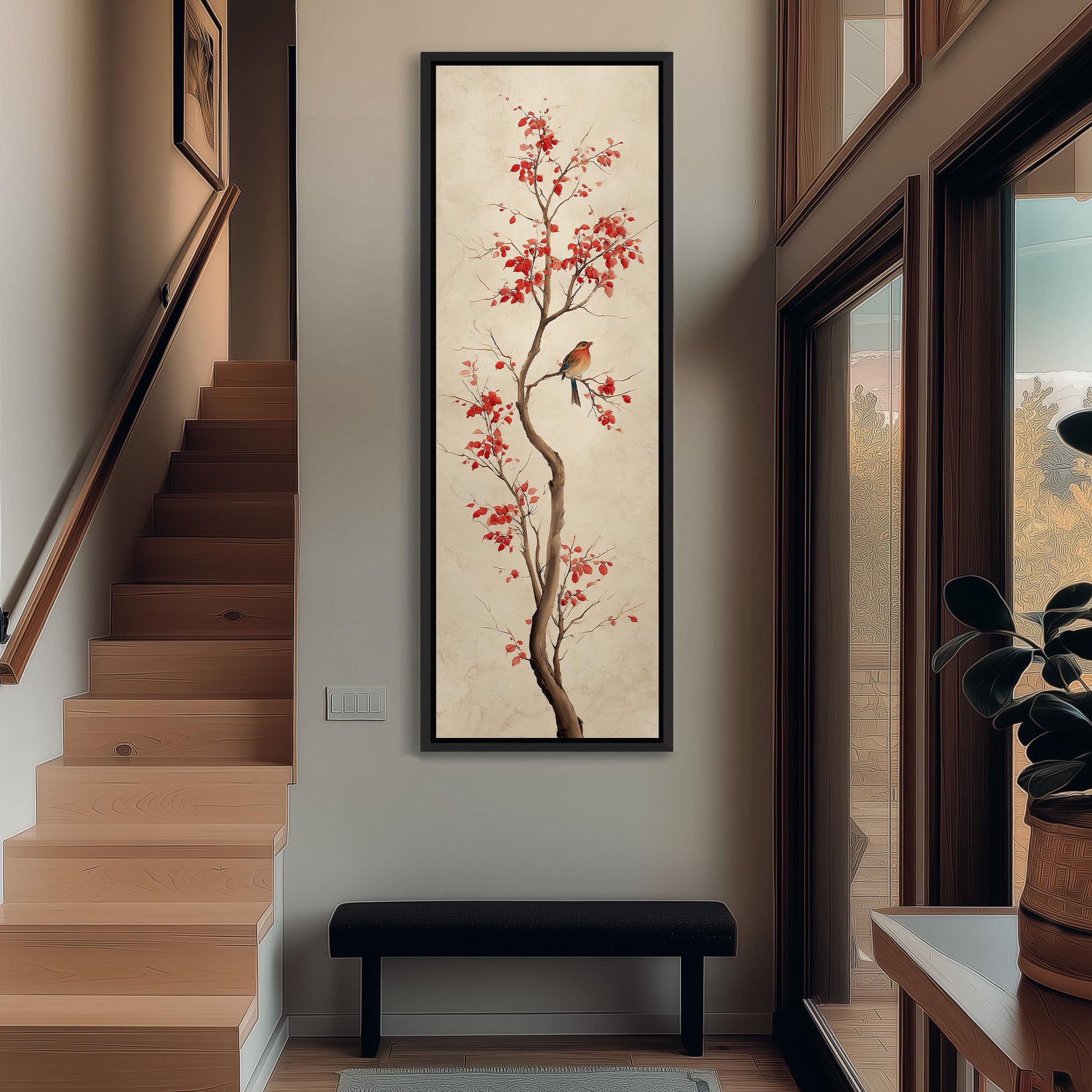 a wooden staircase with a bench below it, and a large framed painting of a tree with red leaves hanging on the wall above the bench.
