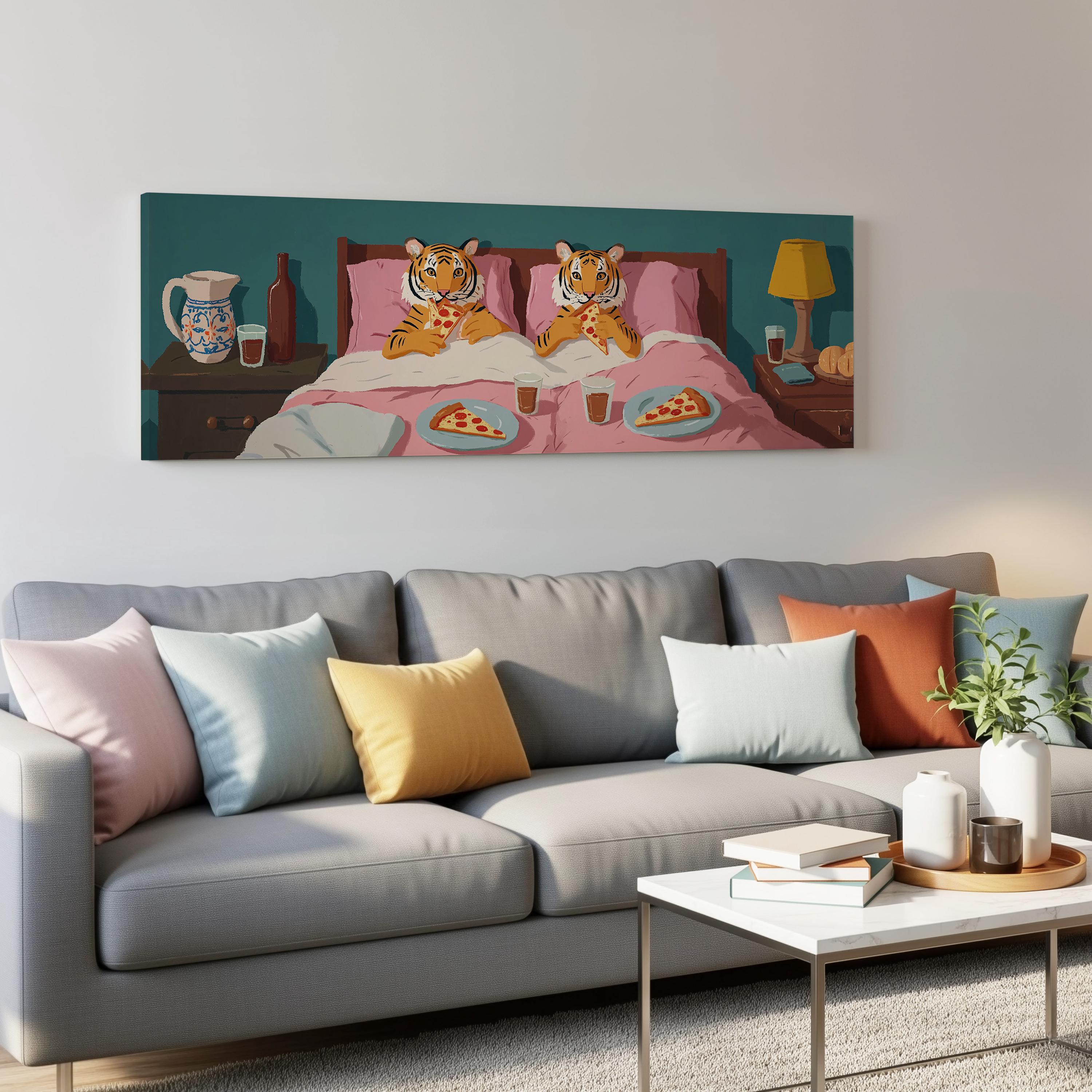 a cozy living room with a gray couch adorned with colorful throw pillows. Above the couch, a large painting features two tiger-like creatures sitting on a bed, enjoying a meal of pizza. The painting is hung on a white wall, and the room is decorated with various items, including a coffee table, books, and a potted plant.