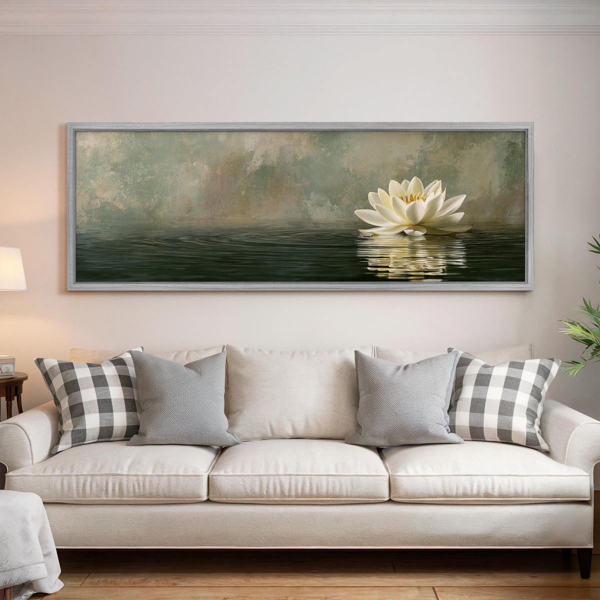 White water lily in soft mist panoramic canvas print above a white sofa in a bright living room