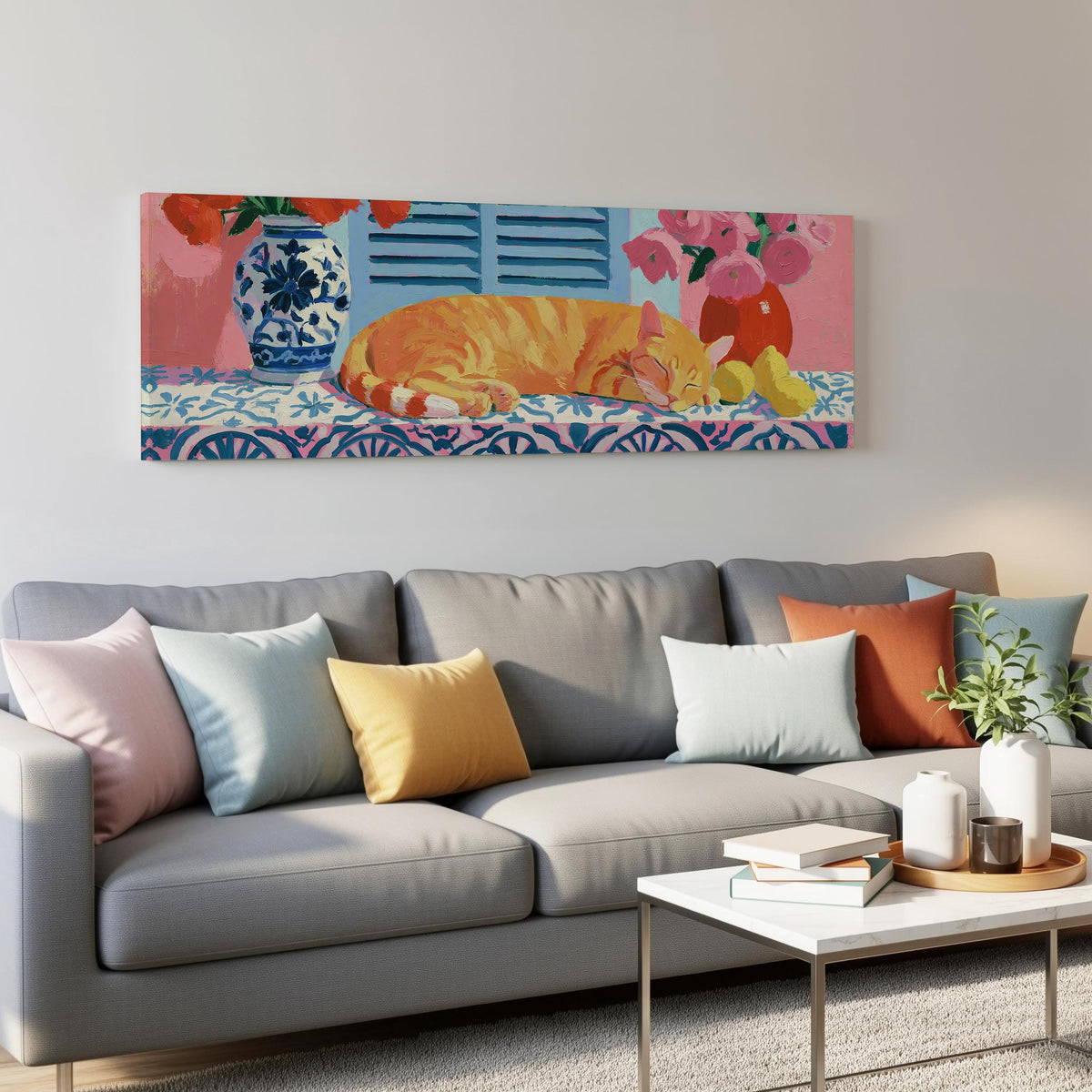 Orange cat napping on a tiled table panoramic canvas print above a grey sofa in a living room