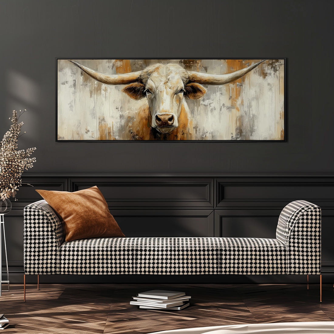 a large painting of a bull's head hanging on a wall above a brown sofa.