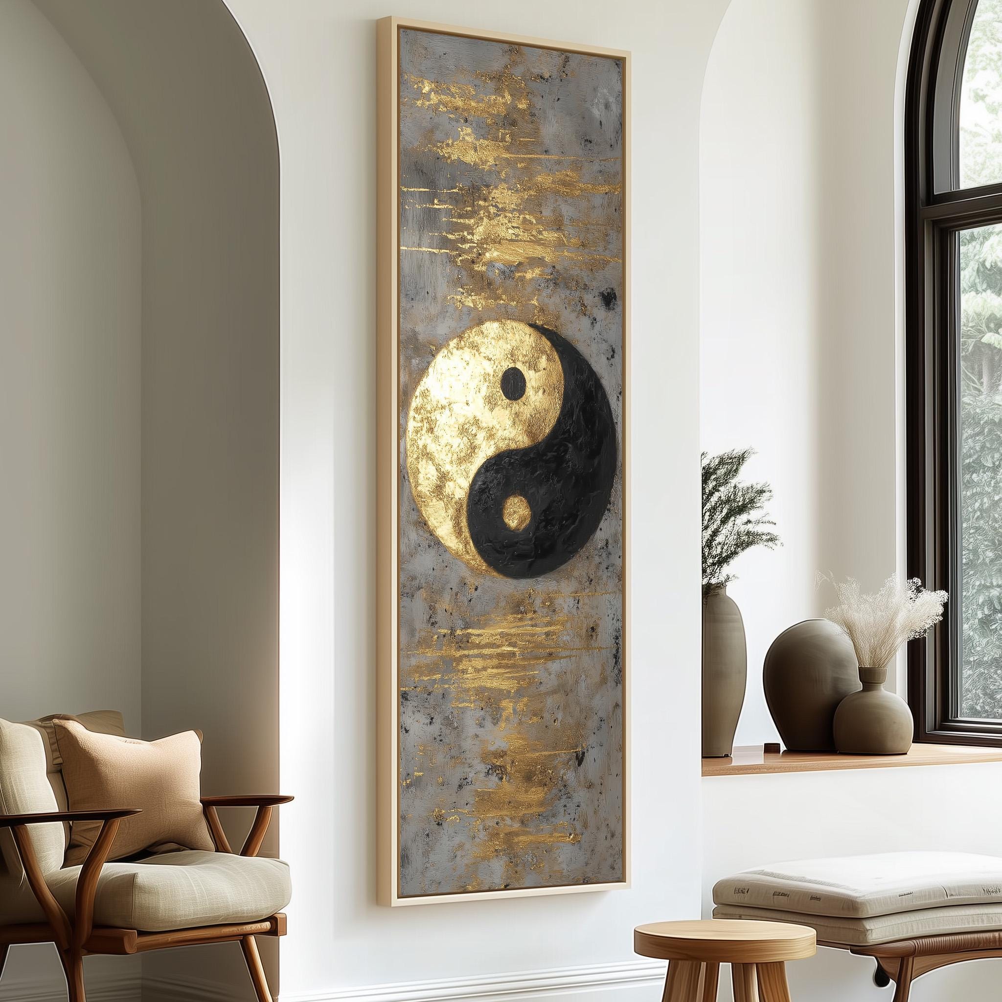 a modern living room with a large framed artwork hanging on the wall, depicting a yin and yang symbol. The room is furnished with a chair, a table, and a vase with flowers, creating a cozy and stylish atmosphere.