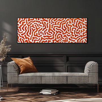a modern living room with a black and white checkered sofa, a stack of books, and a large abstract painting on the wall.