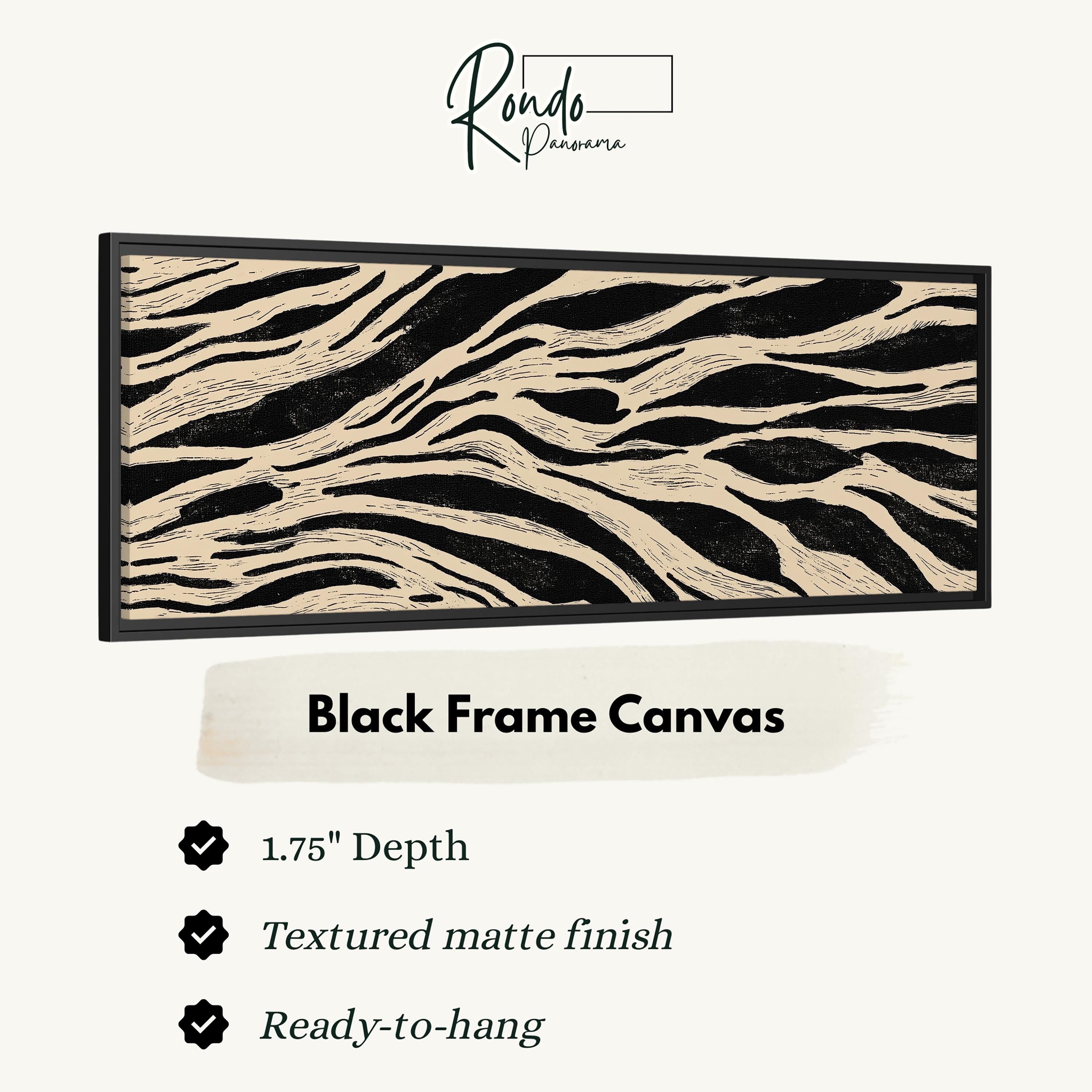 a black frame canvas with a striking zebra print design.