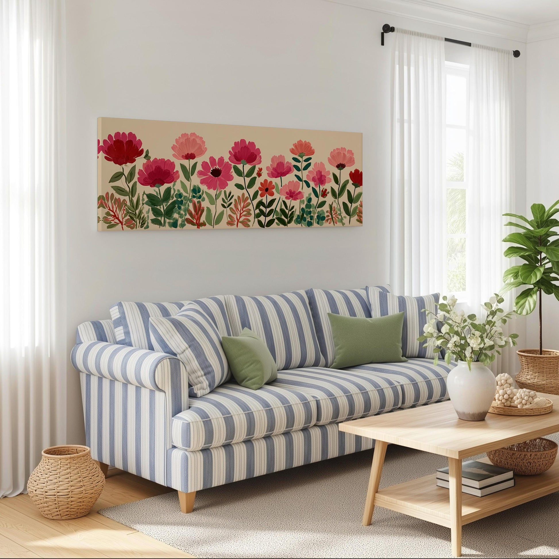 a cozy living room with a striped blue and white sofa, a wooden coffee table, and a large floral artwork hanging on the wall above the sofa.