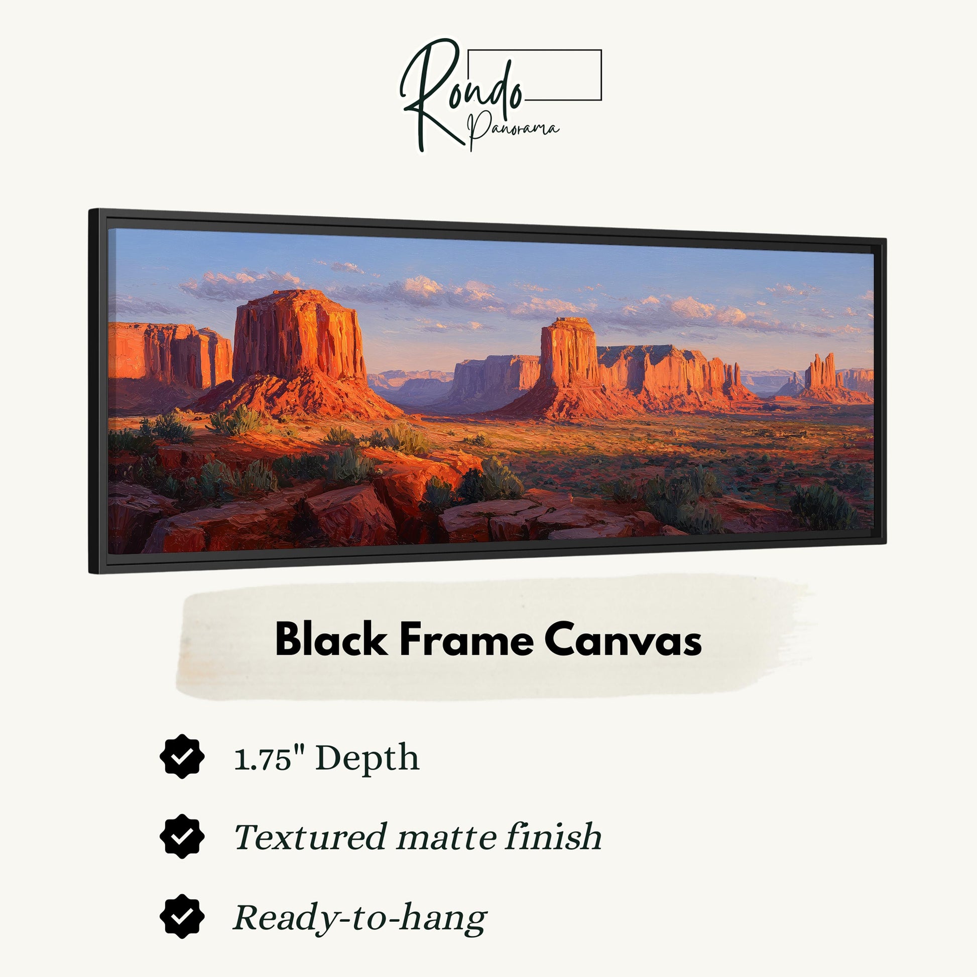 A black frame canvas depicting a desert landscape with mountains in the background.