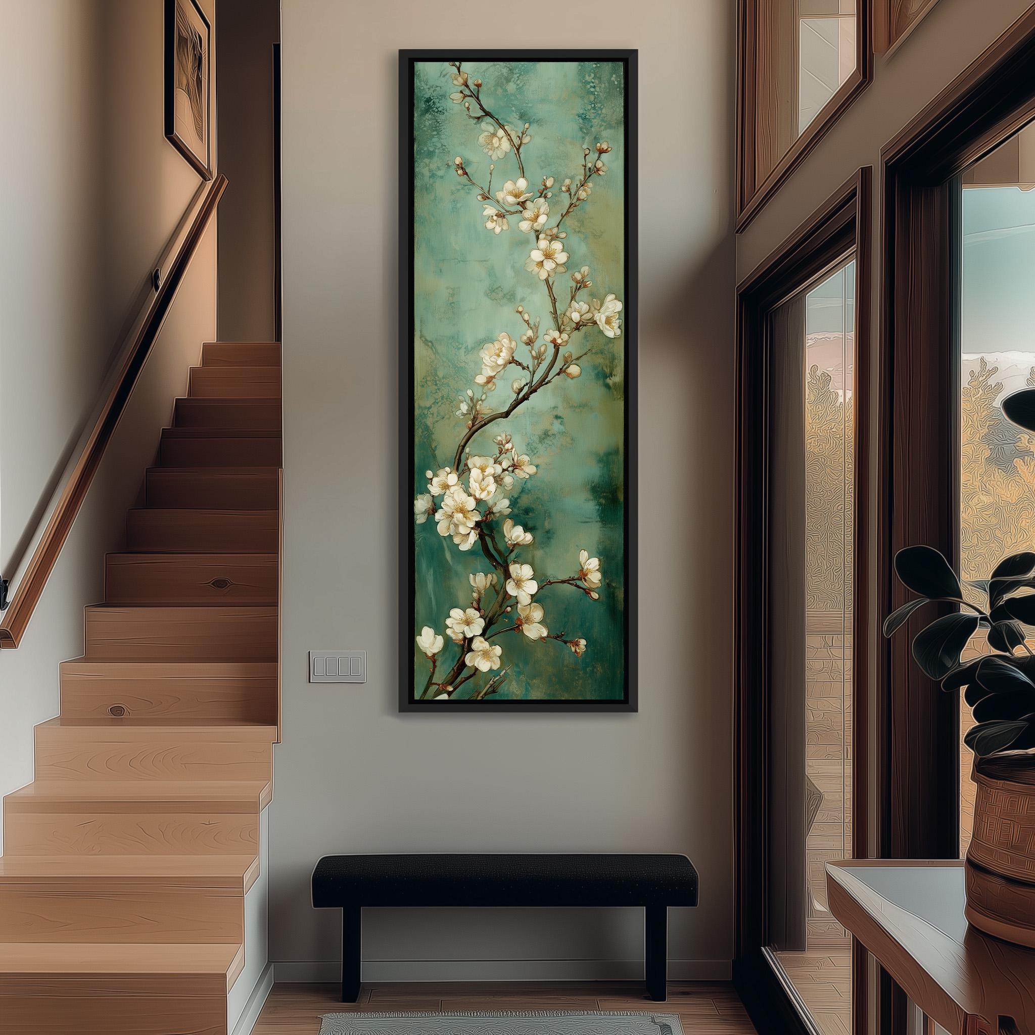 a hallway with a large painting of white flowers hanging on the wall. The painting is framed and appears to be a focal point in the space. The hallway has a wooden staircase and a bench, creating a cozy and inviting atmosphere.