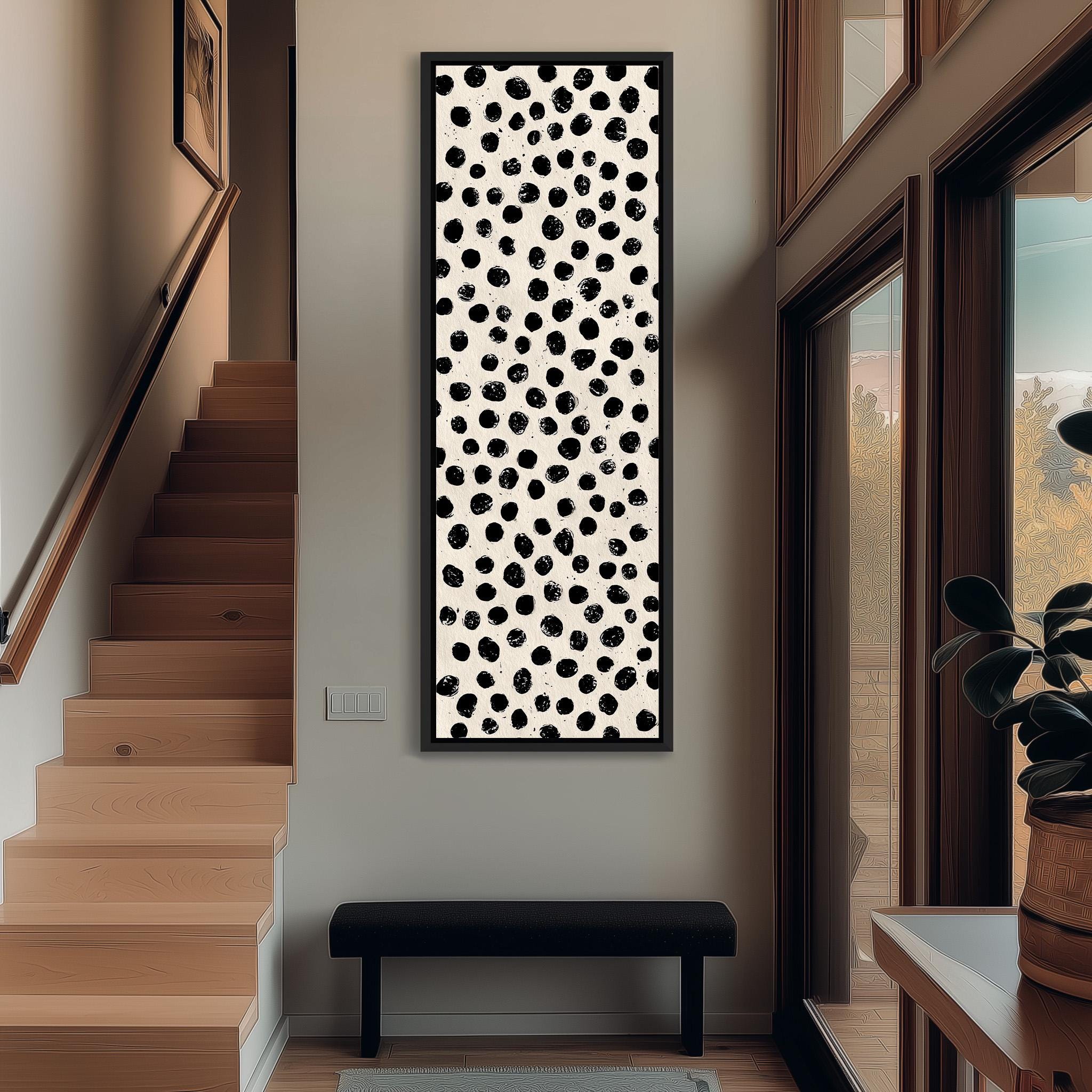 a modern and minimalist interior design with a large black and white abstract artwork hanging on the wall above a black bench.